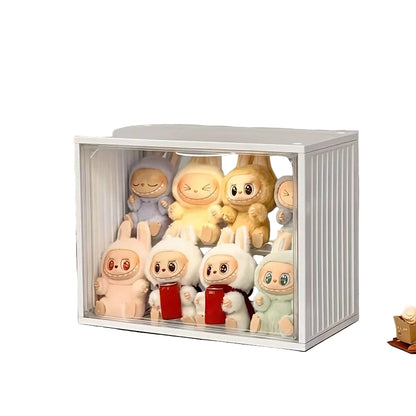 Collection of cartoon-themed figurines in a clear display case on a shelf.